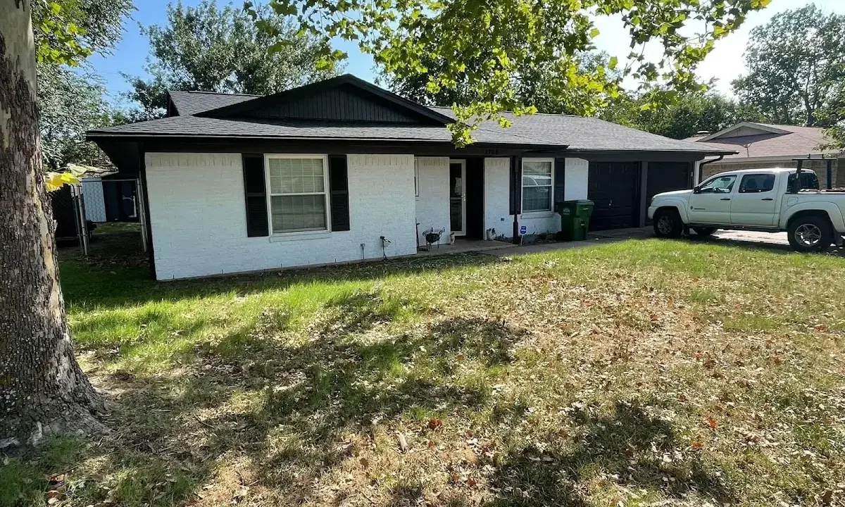 Professional roofing crew working on a residential roof in Pound Ridge